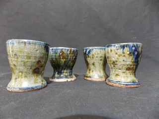Set of Four Glazed Pottery Egg Cups