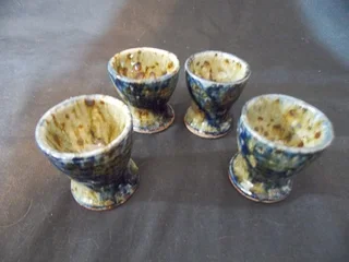 Set of Four Glazed Pottery Egg Cups