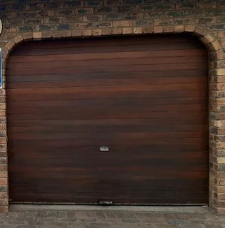 1x Timbercon meranti wooden rollup garage door  R4000.
