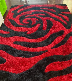 Red and Black abstract shaggy rug.