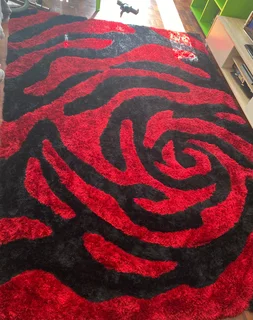 Red and Black abstract shaggy rug.
