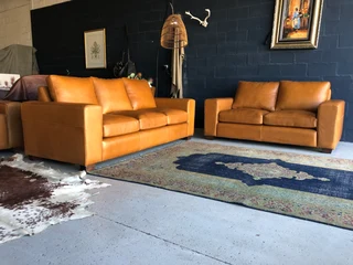 Immaculate 2pc Chobe Style Genuine Leather Lounge Suite. (2.2m Three Seater Plus 1.8m Two Seater)
