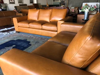 Immaculate 2pc CHOBE STYLE genuine leather lounge suite. (2.2m THREE SEATER plus 1.8m TWO SEATER)
