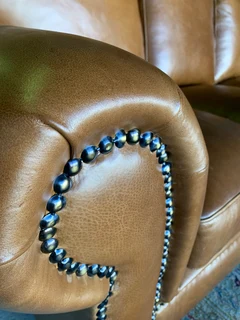 A stunning 2 piece STUDIO STYLE genuine leather lounge suite. (3 &amp; 2 SEATER) Brand new.