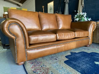 A stunning 2 piece STUDIO STYLE genuine leather lounge suite. (3 &amp; 2 SEATER) Brand new.