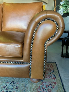 A stunning 2 piece STUDIO STYLE genuine leather lounge suite. (3 &amp; 2 SEATER) Brand new.