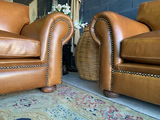 A stunning 2 piece STUDIO STYLE genuine leather lounge suite. (3 &amp; 2 SEATER) Brand new.