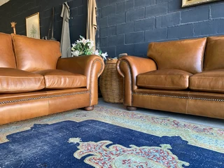 A stunning 2 piece STUDIO STYLE genuine leather lounge suite. (3 &amp; 2 SEATER) Brand new.
