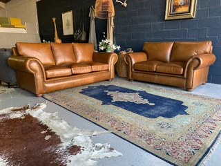 A stunning 2 piece STUDIO STYLE genuine leather lounge suite. (3 &amp; 2 SEATER) Brand new.