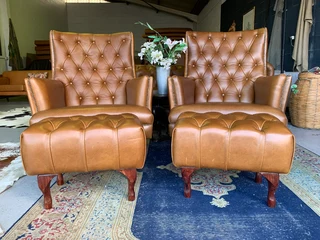 2 x Occasional genuine leather DESIGNER WINGBACK ARMCHIARS plus 2 x footstool ottomans.  R13500 each