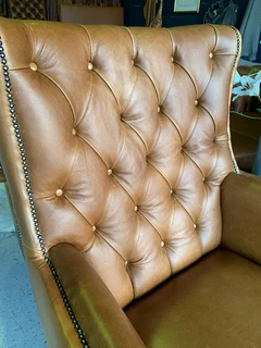 2 x Occasional genuine leather DESIGNER WINGBACK ARMCHIARS plus 2 x footstool ottomans.  R13500 each
