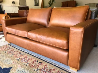 Immaculate 2m full grain gameskin genuine leather CONTEMPORARY DESIGN two seater sofa, Brand new.