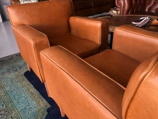 Brand new gameskin genuine leather  MID-CENTURY armchairs. (A modern streamline design) R6500 each .