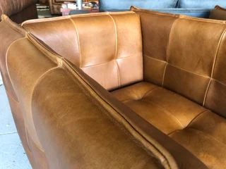 2 x Brand new CONTEMPORARY DESIGN genuine leather armchairs. (TUFFED STITCH DETAILING) R9995 each.