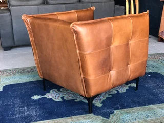 2 x Brand new CONTEMPORARY DESIGN genuine leather armchairs. (TUFFED STITCH DETAILING) R9995 each.