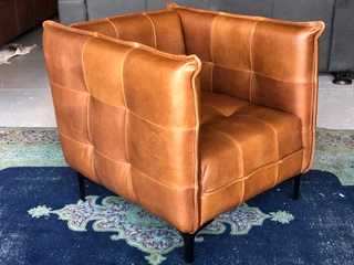 2 x Brand new CONTEMPORARY DESIGN genuine leather armchairs. (TUFFED STITCH DETAILING) R9995 each.