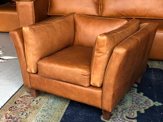 Brand New & Iconic Design  genuine Leather Armchair With Plush Back Rest & Side Cushioning.