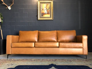 Immaculate 2.2m gameskin genuine leather large three seater couch. (A MODERN SLIMLINE DESIGN)