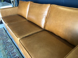 Immaculate 2.2m gameskin genuine leather large three seater couch. (A MODERN SLIMLINE DESIGN)