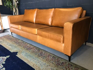 Immaculate 2.2m gameskin genuine leather large three seater couch. (A MODERN SLIMLINE DESIGN)