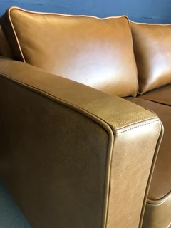 Immaculate 2.2m gameskin genuine leather large three seater couch. (A MODERN SLIMLINE DESIGN)