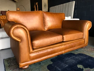 Newly manufactured 2pc  GATES TO AFRICA DESIGN genuine leather lounge suite. (2 x 1.8m TWO SEATERS)