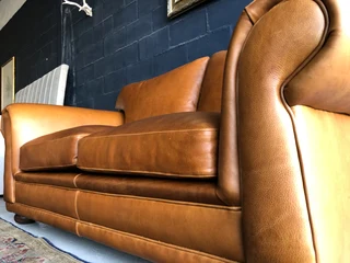 Newly manufactured 2pc  GATES TO AFRICA DESIGN genuine leather lounge suite. (2 x 1.8m TWO SEATERS)