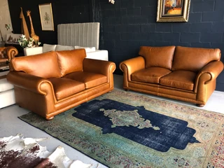 Newly manufactured 2pc  GATES TO AFRICA DESIGN genuine leather lounge suite. (2 x 1.8m TWO SEATERS)