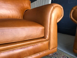 Newly manufactured 2pc  GATES TO AFRICA DESIGN genuine leather lounge suite. (2 x 1.8m TWO SEATERS)