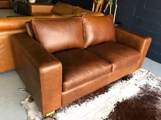Stunning 1.8m Two seater gameskin genuine leather couch. (A  MODERN CASA DESIGN) Brand new condition