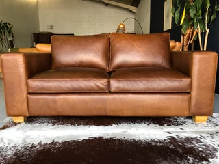 Stunning 1.8m Two seater gameskin genuine leather couch. (A  MODERN CASA DESIGN) Brand new condition