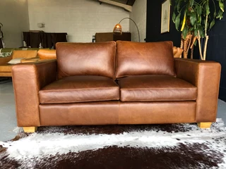 Stunning 1.8m Two seater gameskin genuine leather couch. (A  MODERN CASA DESIGN) Brand new condition