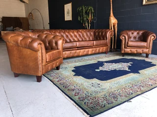 A Magnificent 3pc Genuine Leather Chesterfield Lounge Suite. (1 X Three Seater Plus 2 X Tubchairs)