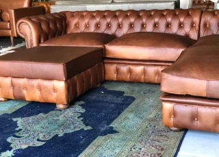 Brand new (3m x 2m) TRADITIONAL CHESTERFIELD  genuine leather corner unit plus 1m storage ottoman.