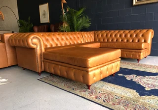 A classic 3m x 2m genuine leather Chesterfield L-shape corner lounge suite plus 1m modular ottoman.