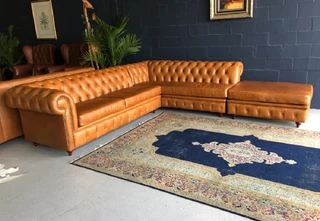 A classic 3m x 2m genuine leather Chesterfield L-shape corner lounge suite plus 1m modular ottoman.