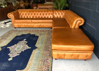 A classic 3m x 2m genuine leather Chesterfield L-shape corner lounge suite plus 1m modular ottoman.