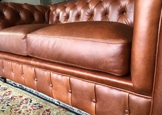 A elegant 1.8m  genuine leather CHESTERFIELD two seater sofa. Brand new. (WITH PIPING DETAILING)