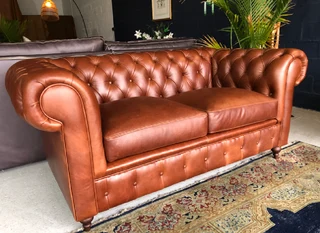 A elegant 1.8m  genuine leather CHESTERFIELD two seater sofa. Brand new. (WITH PIPING DETAILING)