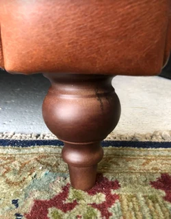 A elegant 1.8m  genuine leather CHESTERFIELD two seater sofa. Brand new. (WITH PIPING DETAILING)