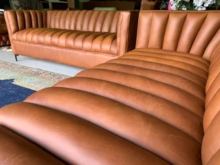 A sophisticated 2 piece full  genuine leather lounge suite. (A DESIGN SET YOU APART FROM THE REST)