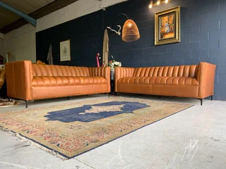 A sophisticated 2 piece full  genuine leather lounge suite. (A DESIGN SET YOU APART FROM THE REST)