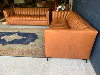 A sophisticated 2 piece full  genuine leather lounge suite. (A DESIGN SET YOU APART FROM THE REST)