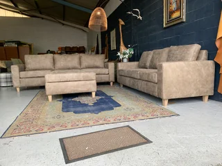 A sophisticated 3pc Zambezi genuine leather lounge suite 2 x THREE SEATERS plus 1 x  STORAGE OTTOMA