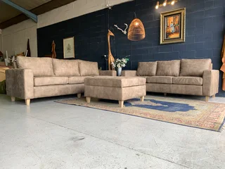 A sophisticated 3pc Zambezi genuine leather lounge suite 2 x THREE SEATERS plus 1 x  STORAGE OTTOMA