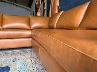 A magnificent (3m x 2.5m) full grain genuine leather ANNILINE DESIGN L-shape corner lounge suite.