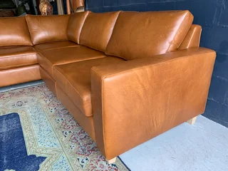 A magnificent (3m x 2.5m) full grain genuine leather ANNILINE DESIGN L-shape corner lounge suite.