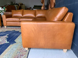 A magnificent (3m x 2.5m) full grain genuine leather ANNILINE DESIGN L-shape corner lounge suite.