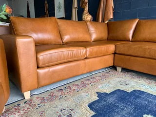 A magnificent (3m x 2.5m) full grain genuine leather ANNILINE DESIGN L-shape corner lounge suite.