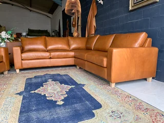 A magnificent (3m x 2.5m) full grain genuine leather ANNILINE DESIGN L-shape corner lounge suite.